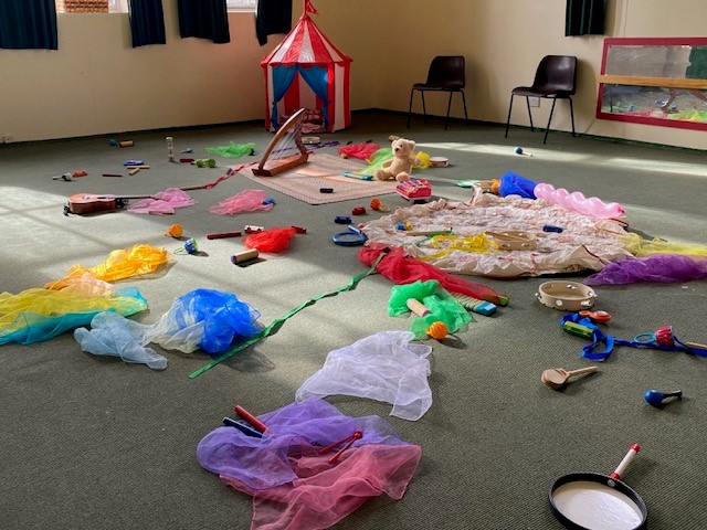 Creative play area with vibrant props and instruments.